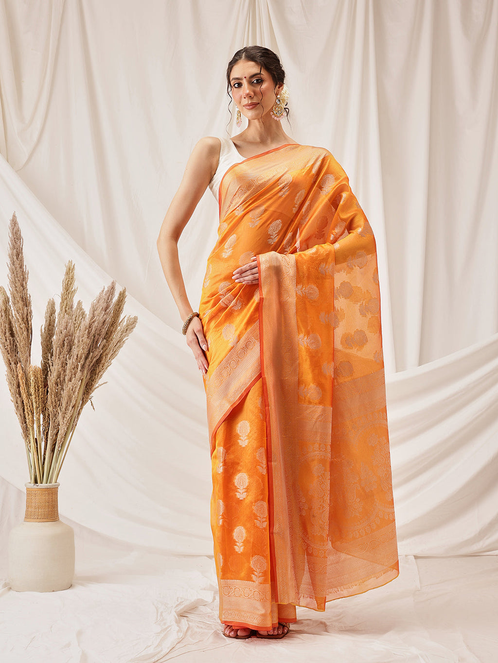 Yellow Banarasi Organza silk saree featuring intricate floral weaves