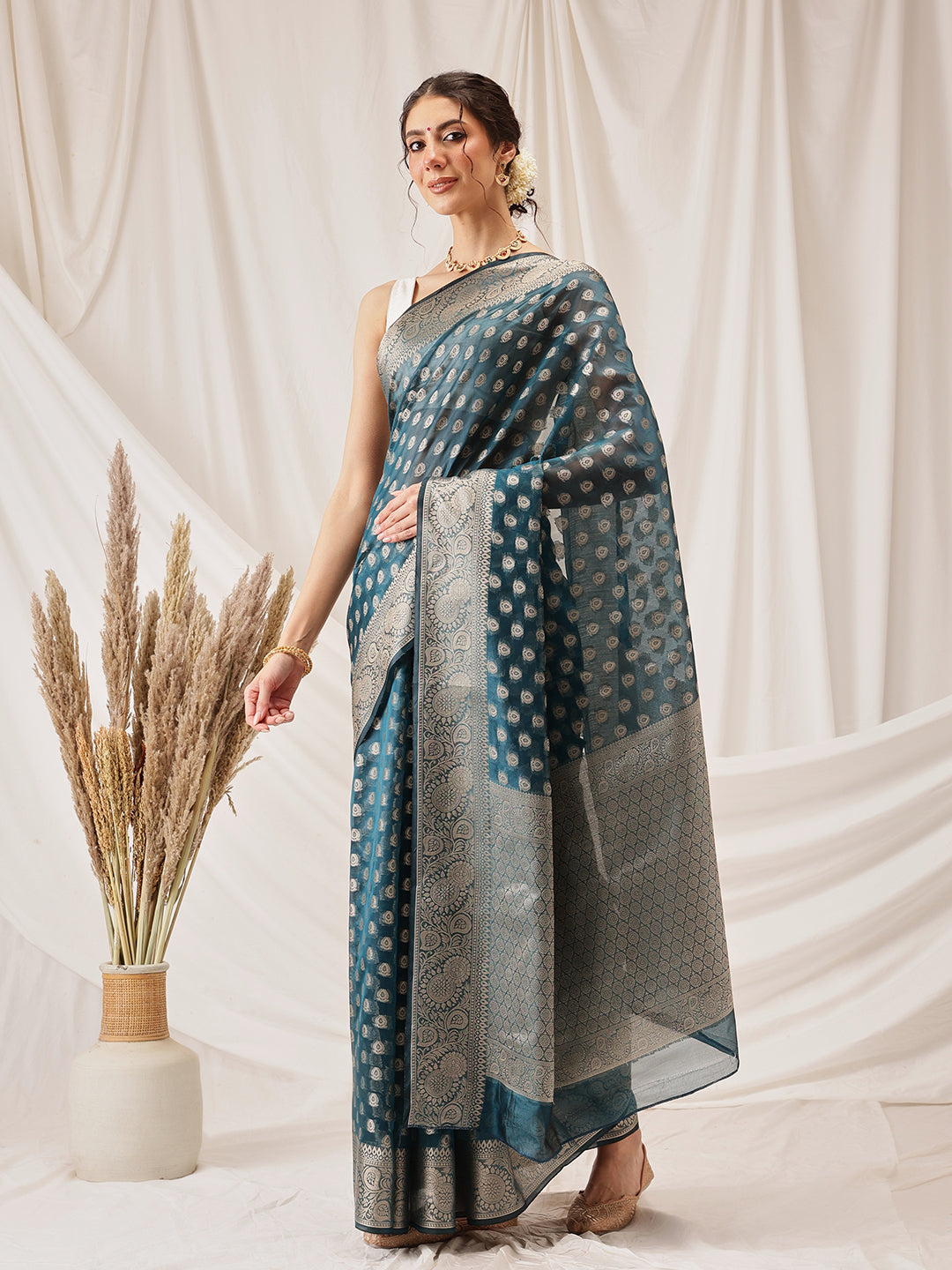 Teal Banarasi Organza Silk saree with intricate floral woven patterns