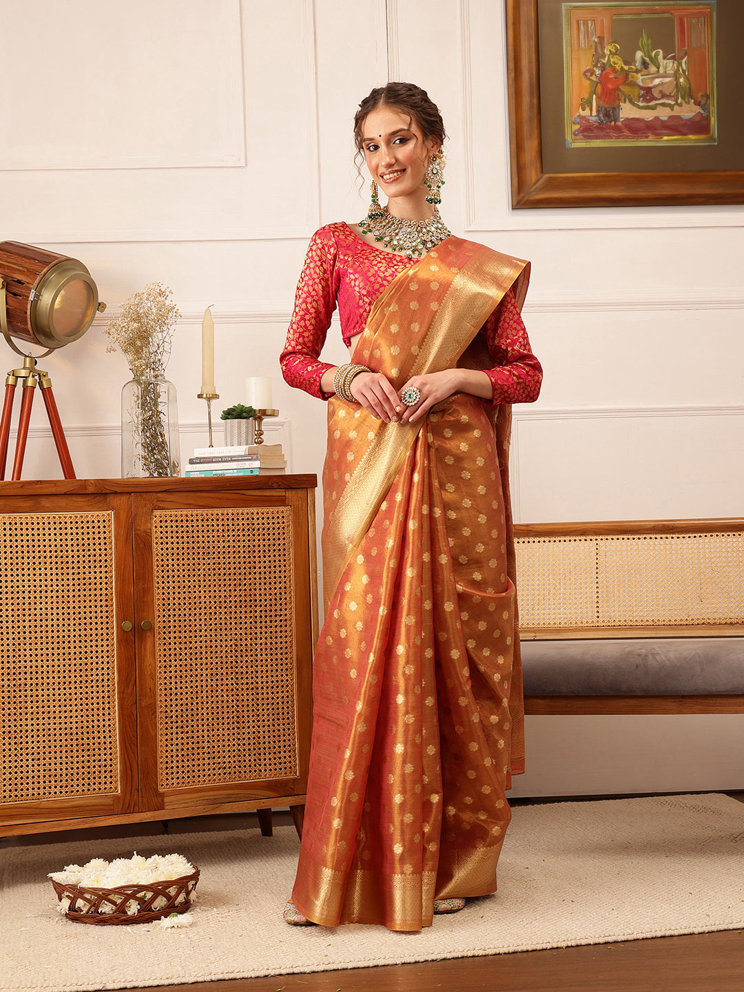 Peach Kanjivaram tissue silk saree featuring intricate floral zari woven details