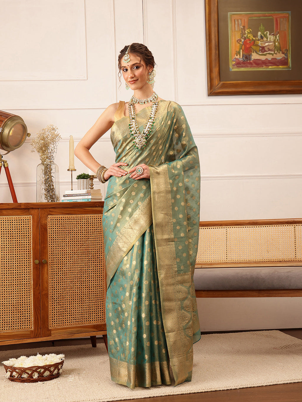 Stunning teal Kanjivaram tissue silk saree with intricate floral zari work