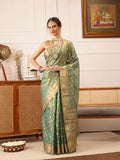 Stunning teal Kanjivaram tissue silk saree with intricate floral zari work
