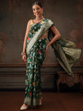 Green Jamdani cotton saree featuring intricate floral woven thread work details.
