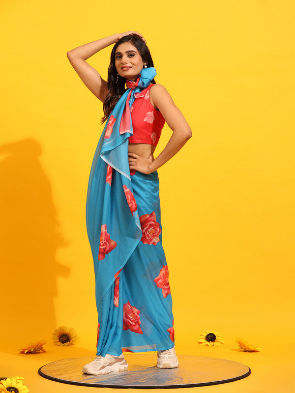 Blue silk blend saree with delicate floral print and matching unstitched blouse fabric.
