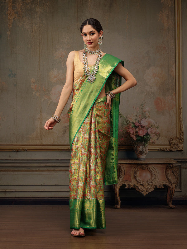 Green pure silk saree with intricate gold woven zari design and ethnic motifs