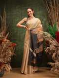 Beige cotton tissue saree with delicate floral digital prints draped elegantly.