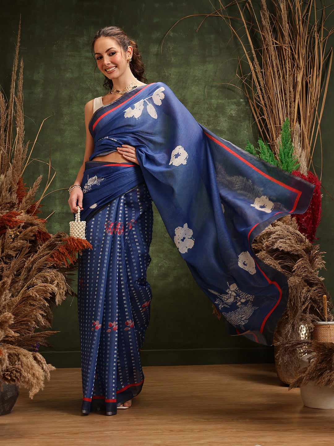 Navy blue cotton tissue saree with elegant floral digital prints.