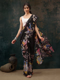 Black polyester saree with digital floral print and matching unstitched blouse piece.