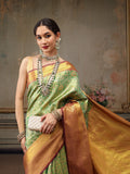Green pure silk saree featuring detailed woven Zari and floral patterns