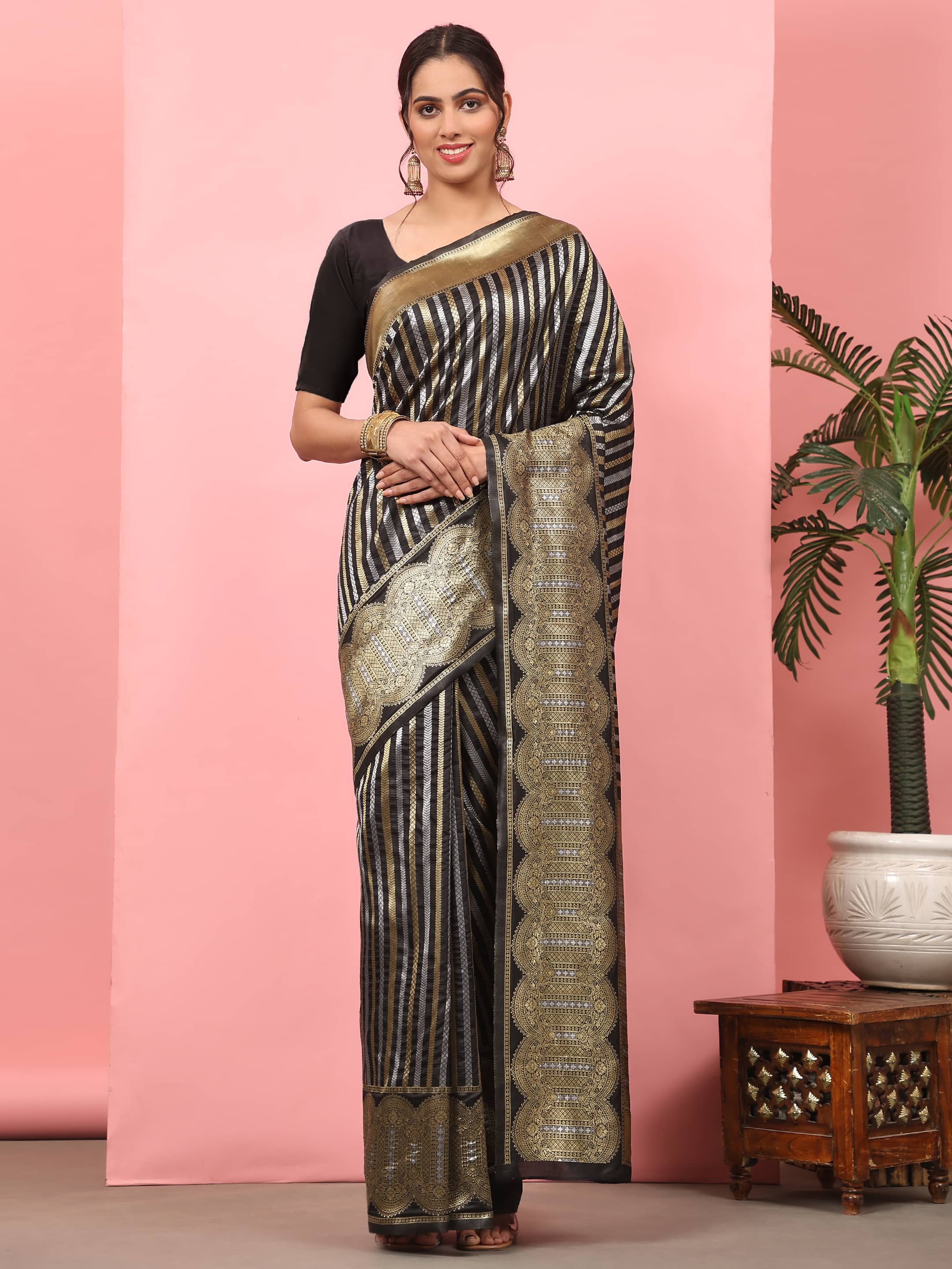 Black Banarasi art silk saree featuring a classic striped pattern and zari weaving.