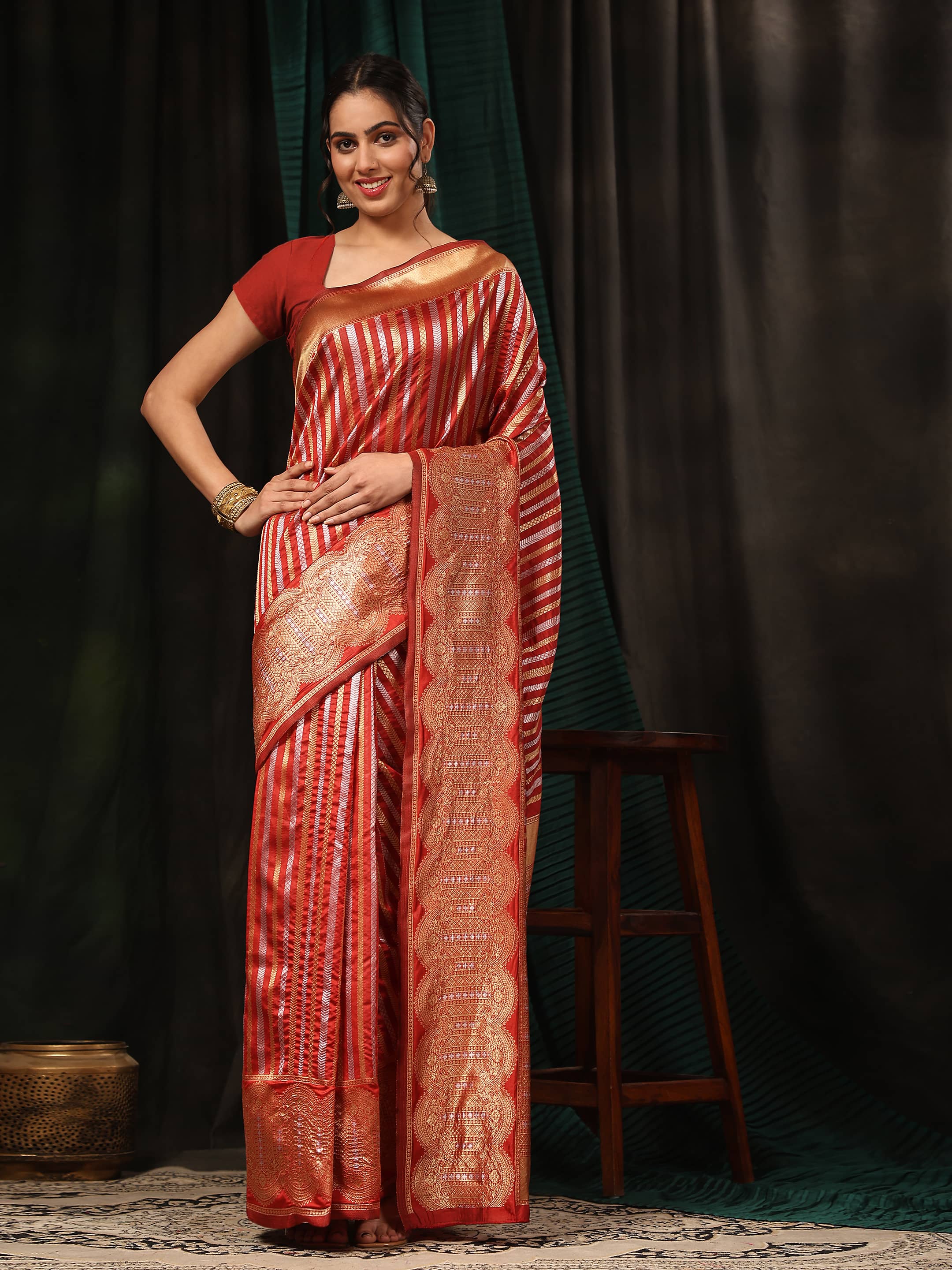 Red Banarasi art silk saree with striped pattern and zari weaving