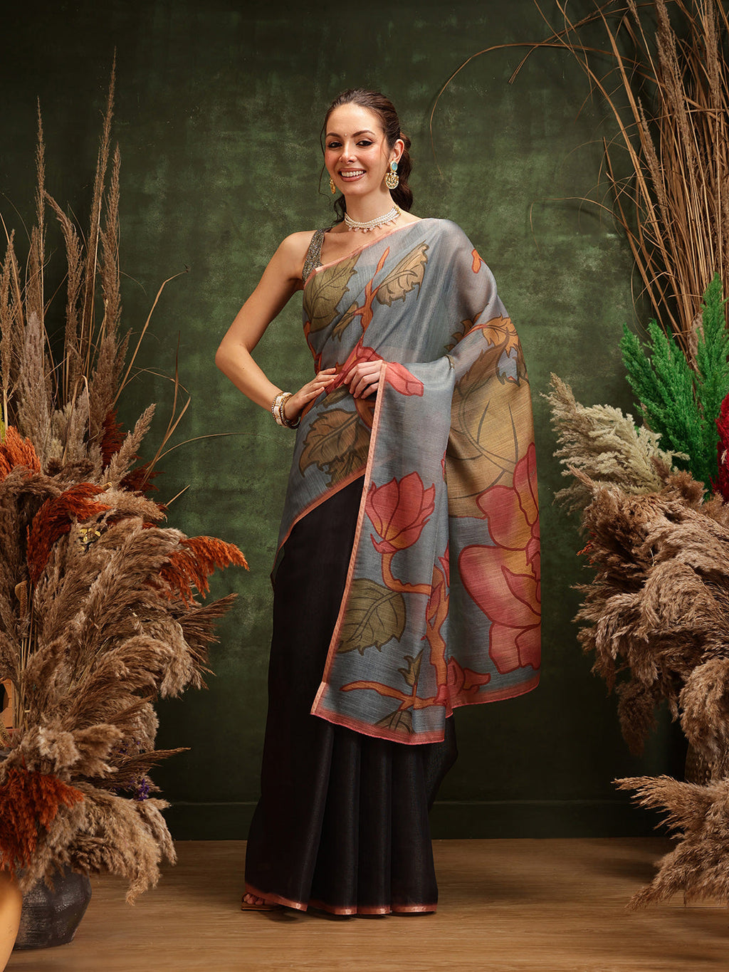 Elegant black cotton silk saree with colorful floral digital print designs.
