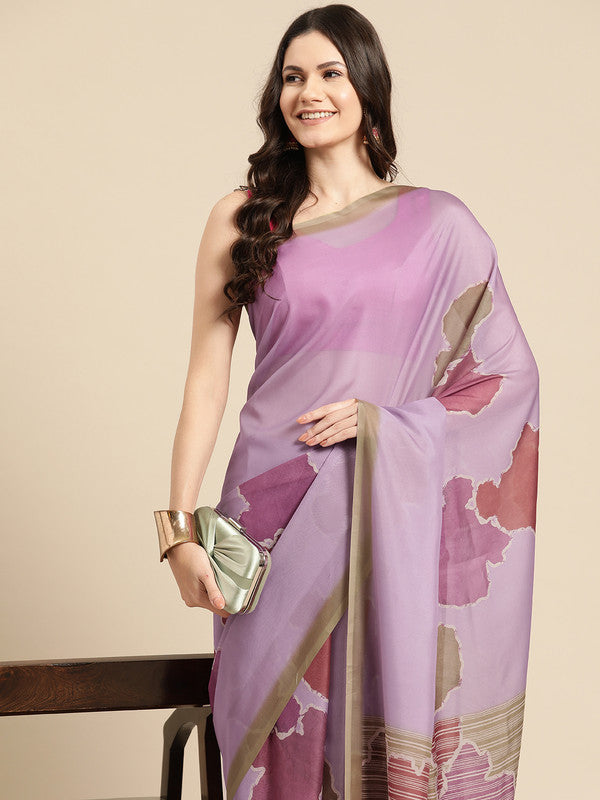 A chic purple silk blend saree with modern abstract prints, including an unstitched blouse.
