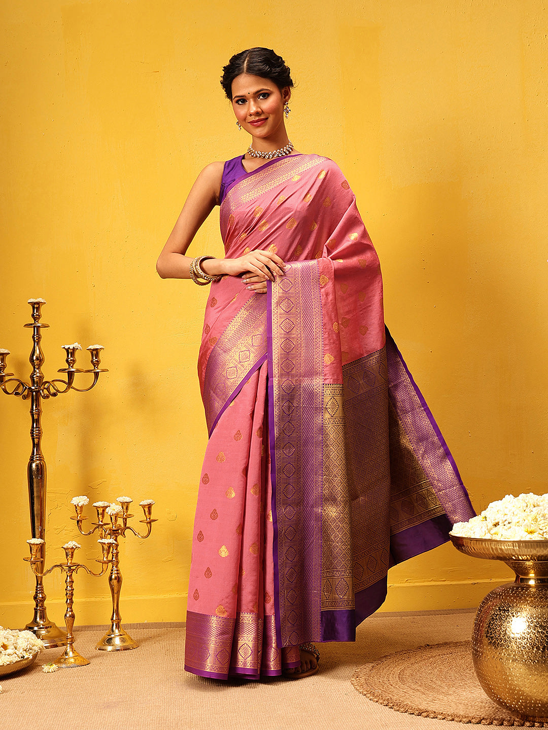 Pink Kanjeevaram silk saree with intricate traditional woven patterns