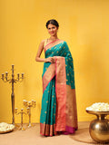 Teal Kanjeevaram silk saree with intricate woven traditional pattern