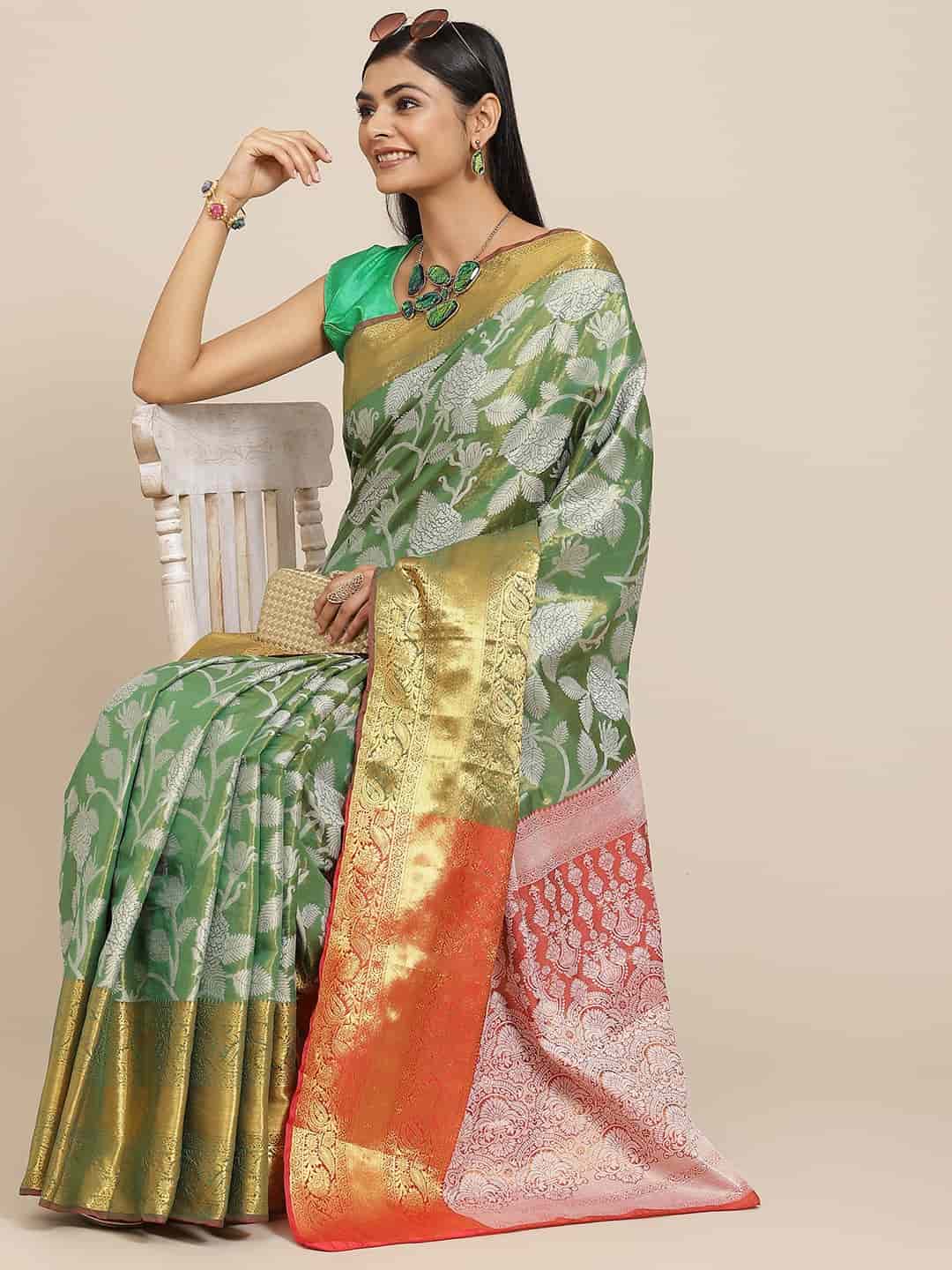 Green Banarasi Tissue Silk Saree featuring floral gold Zari work