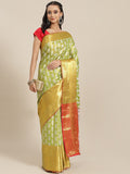 Green floral patterned brocade saree with zari work and unstitched blouse