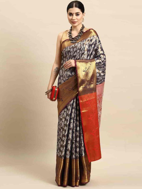 Navy blue brocade saree with detailed floral zari weaving and matching blouse.