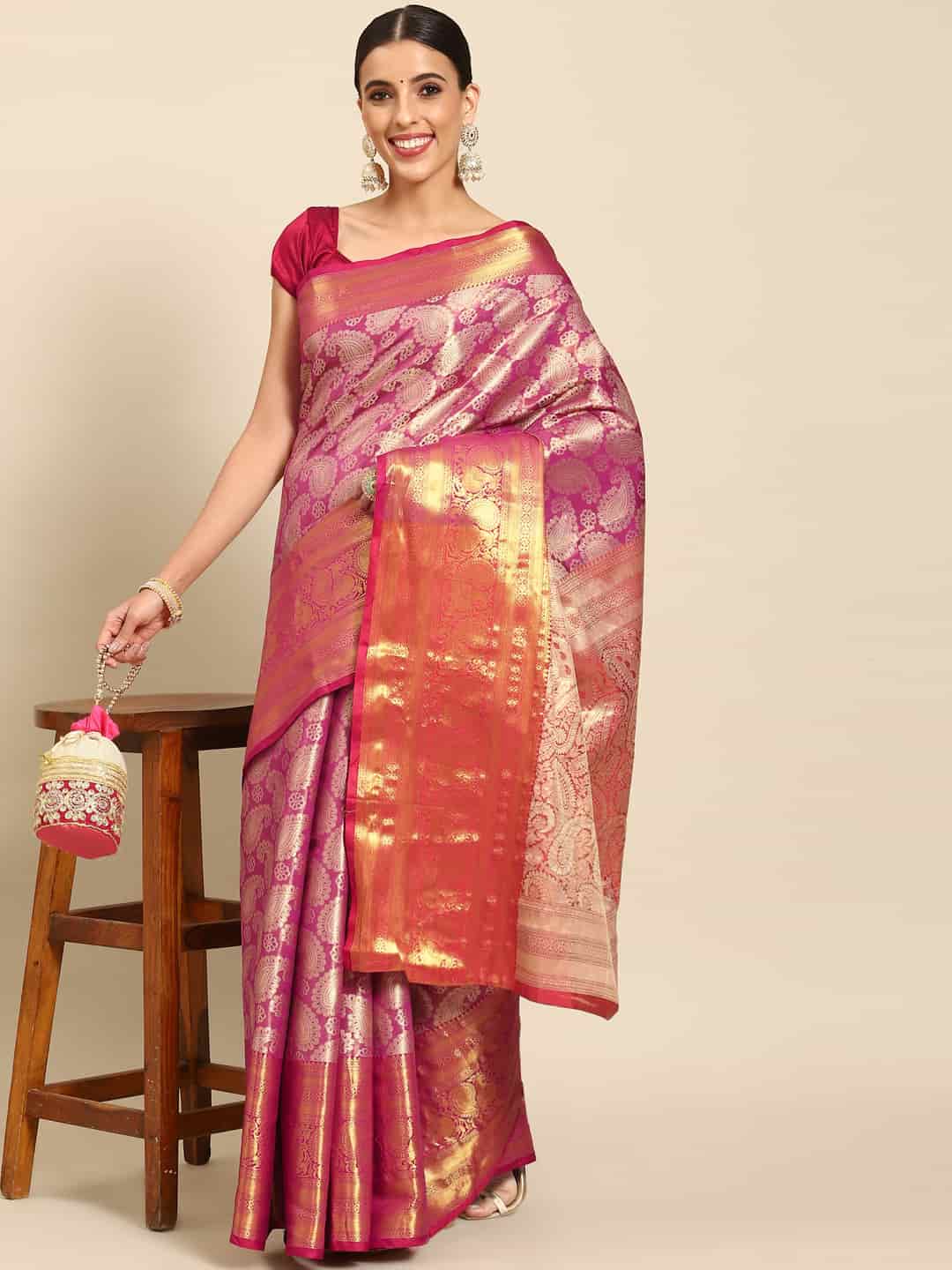 Pink Art Silk saree featuring woven Zari accents and floral patterns with unstitched blouse