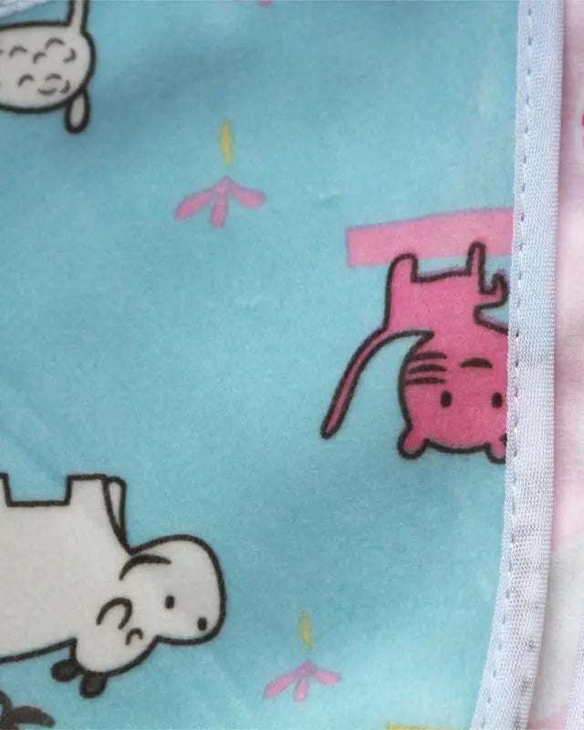 Fabric with cartoon character pattern on a light blue background