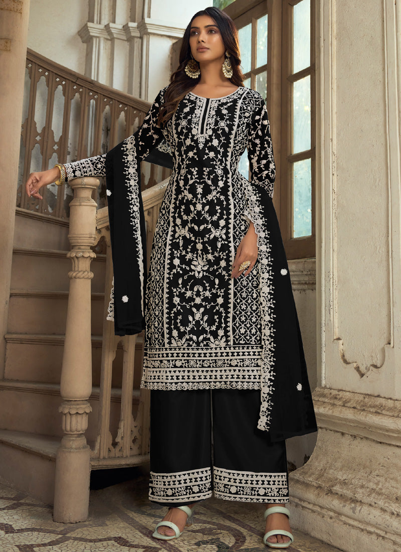 Black A-line net embroidered kurta with matching palazzo pants and dupatta