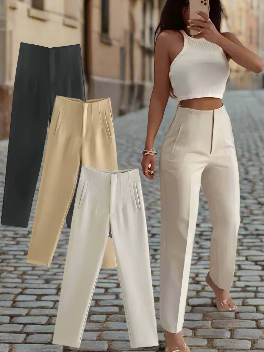 Model wearing slim-fit high-waisted trousers in cream with a white top, styled for a professional look