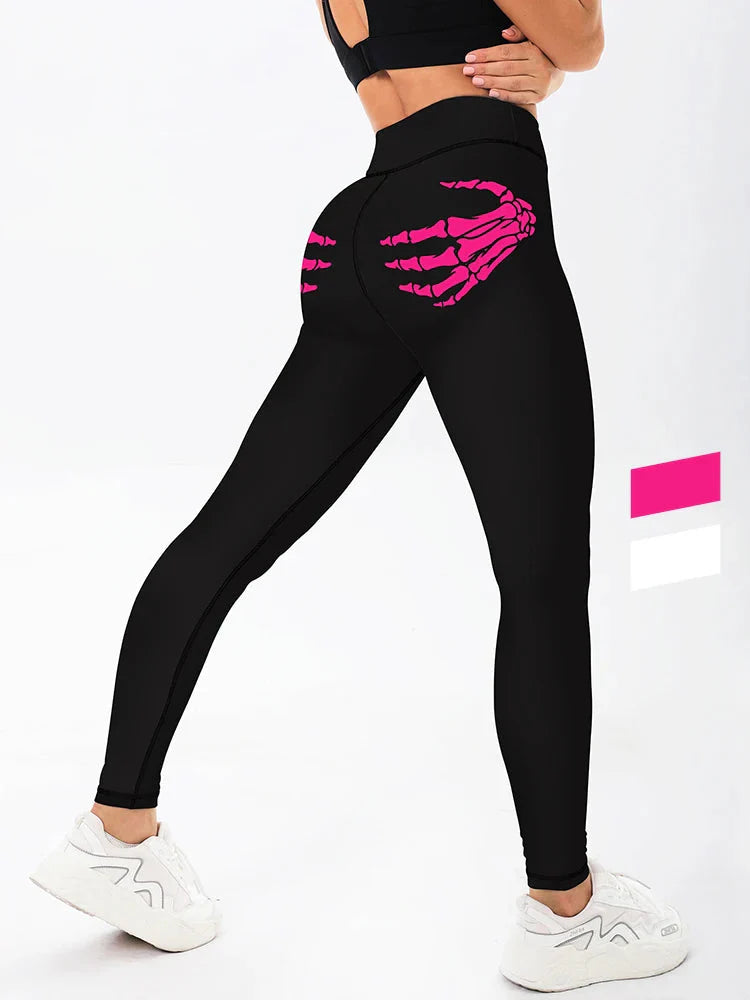 Women wearing black high-waisted yoga leggings with a skull claw pattern.