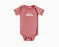 Minimalist baby onesie in solid dusty rose color with snap leg closures.
