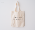 Minimalist natural cotton market tote with black typography reading Seeking God in the Everyday