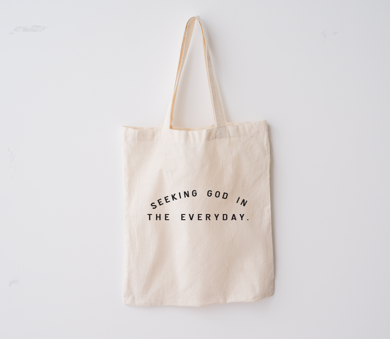 Minimalist natural cotton market tote with black typography reading Seeking God in the Everyday