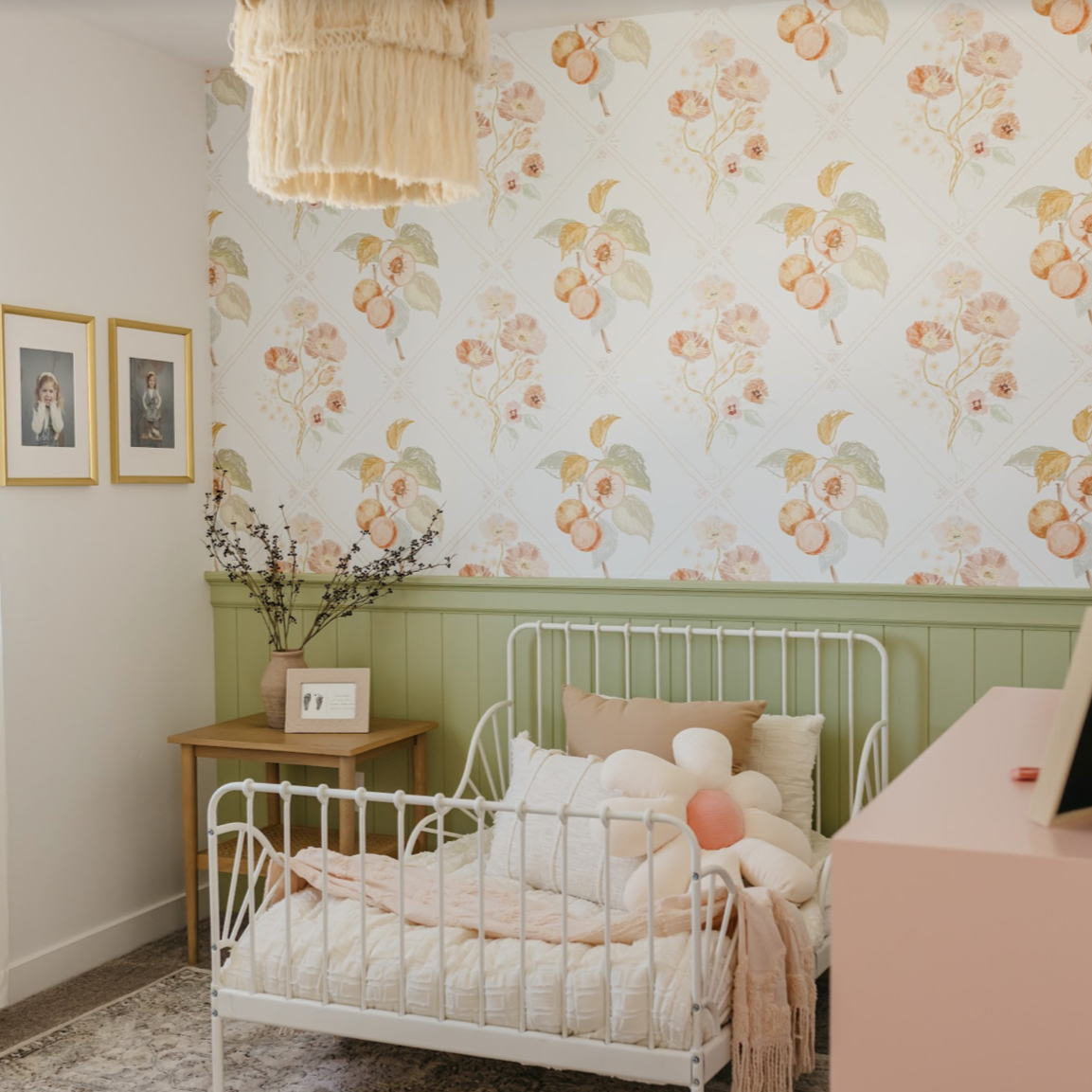 Ingrid floral wallpaper featuring white, peach, and sage-green botanical details
