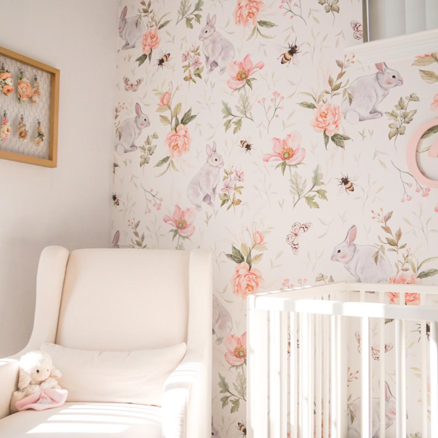Posey floral wallpaper in cream, blush-pink, and sage-green for a nursery.