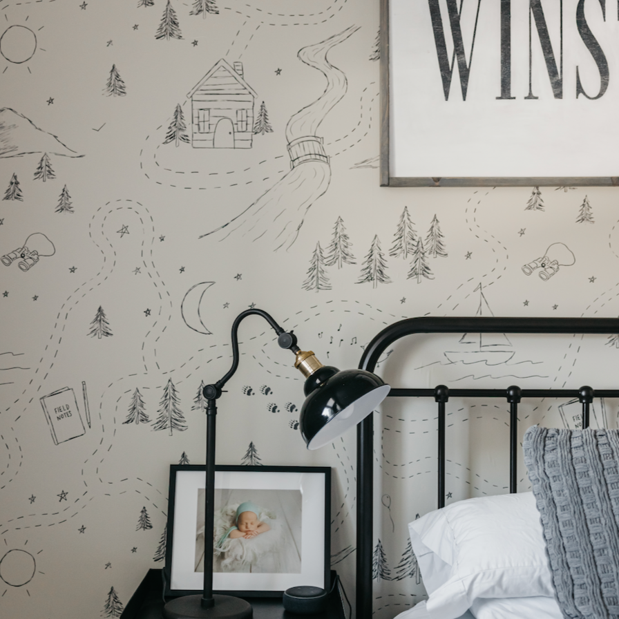 Michael wallpaper featuring a whimsical nature-inspired pattern in beige, black, and olive-green.
