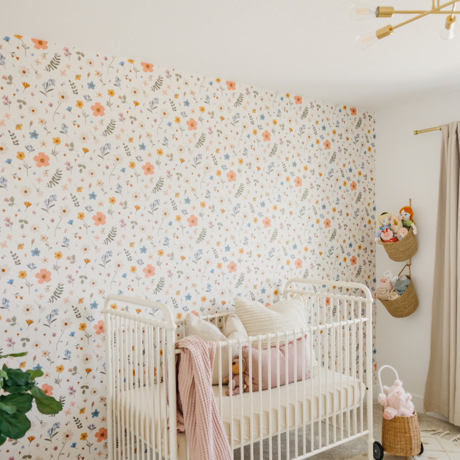 Jane floral wallpaper in sage green, peach, and mustard yellow colors.