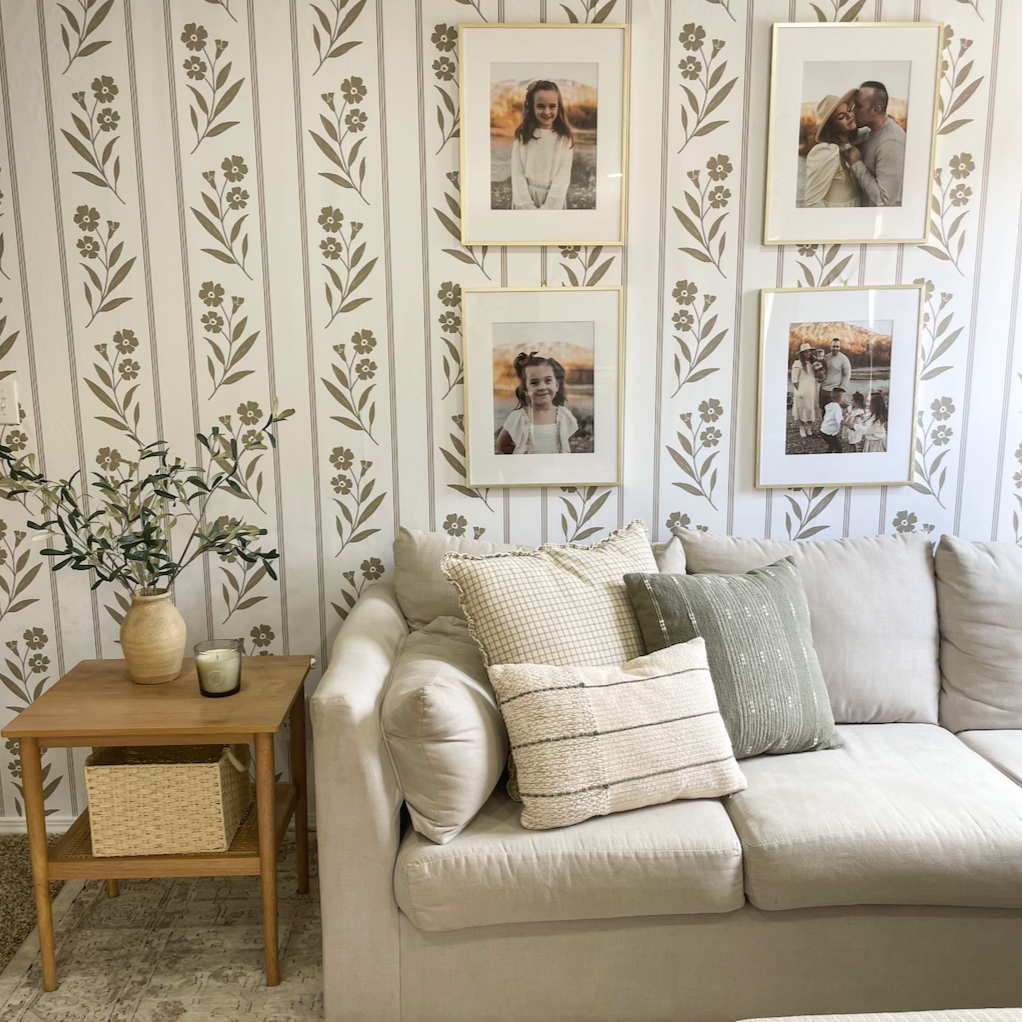 A beautiful wallpaper featuring soft blush pink background and delicate dusty rose floral stripes in a romantic cottagecore bedroom.