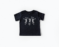 Dancing Skeletons graphic tee in charcoal and white colors.