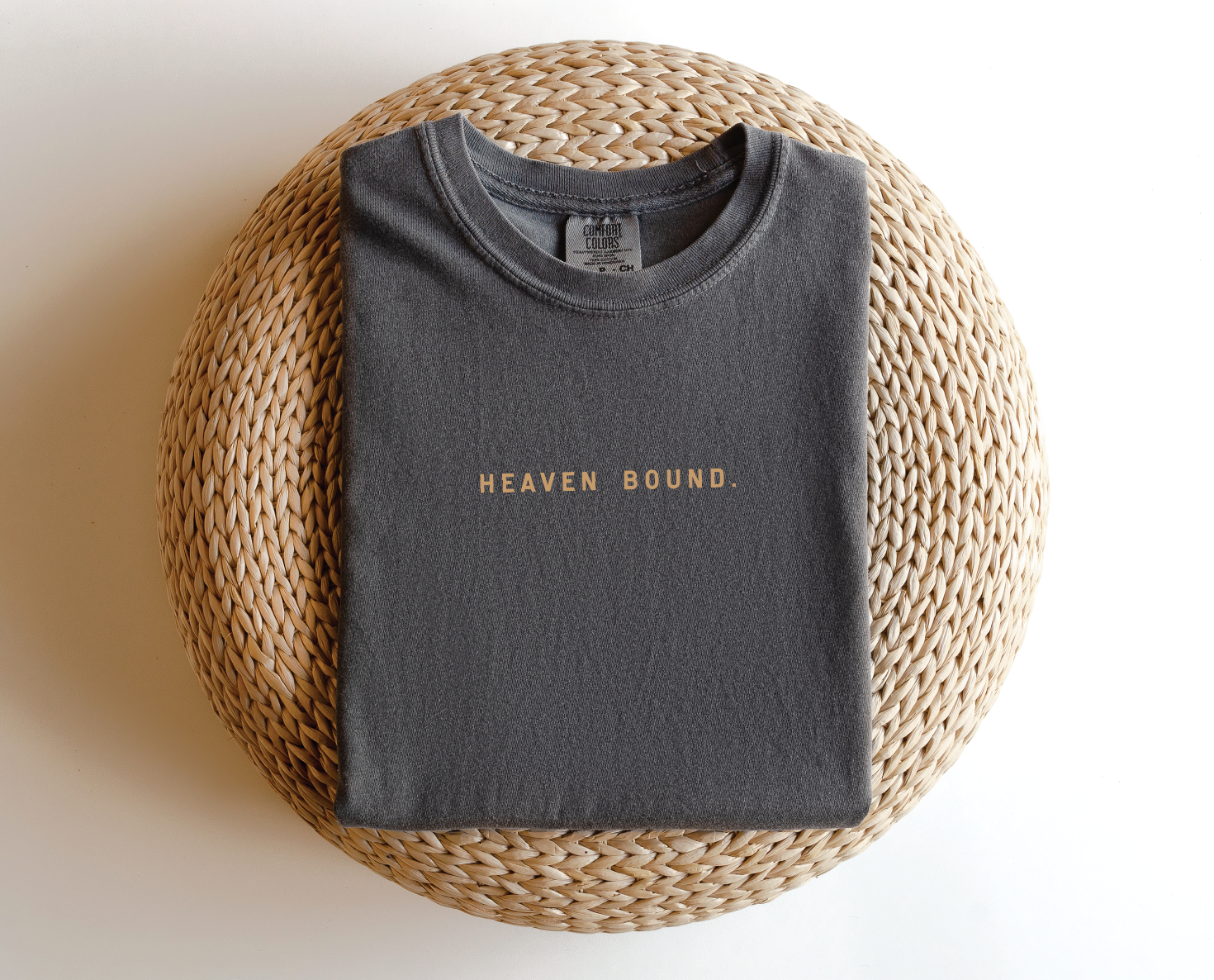 Unisex Heaven Bound garment-dyed tee in cream and charcoal colorways.