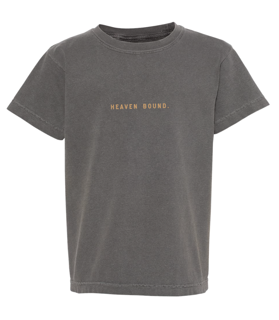 Child wearing a minimalist neutral-on-neutral Heaven Bound streetwear tee in charcoal.