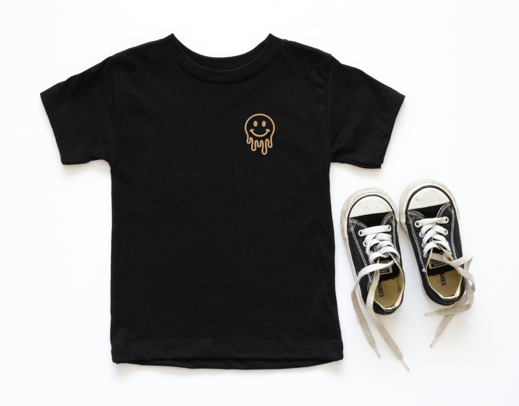 Unisex black and white Drippy Smiley pocket tee styled for a casual streetwear look.