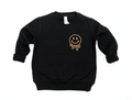 Drippy Smiley graphic pullover sweatshirt in black and tan knit fabric