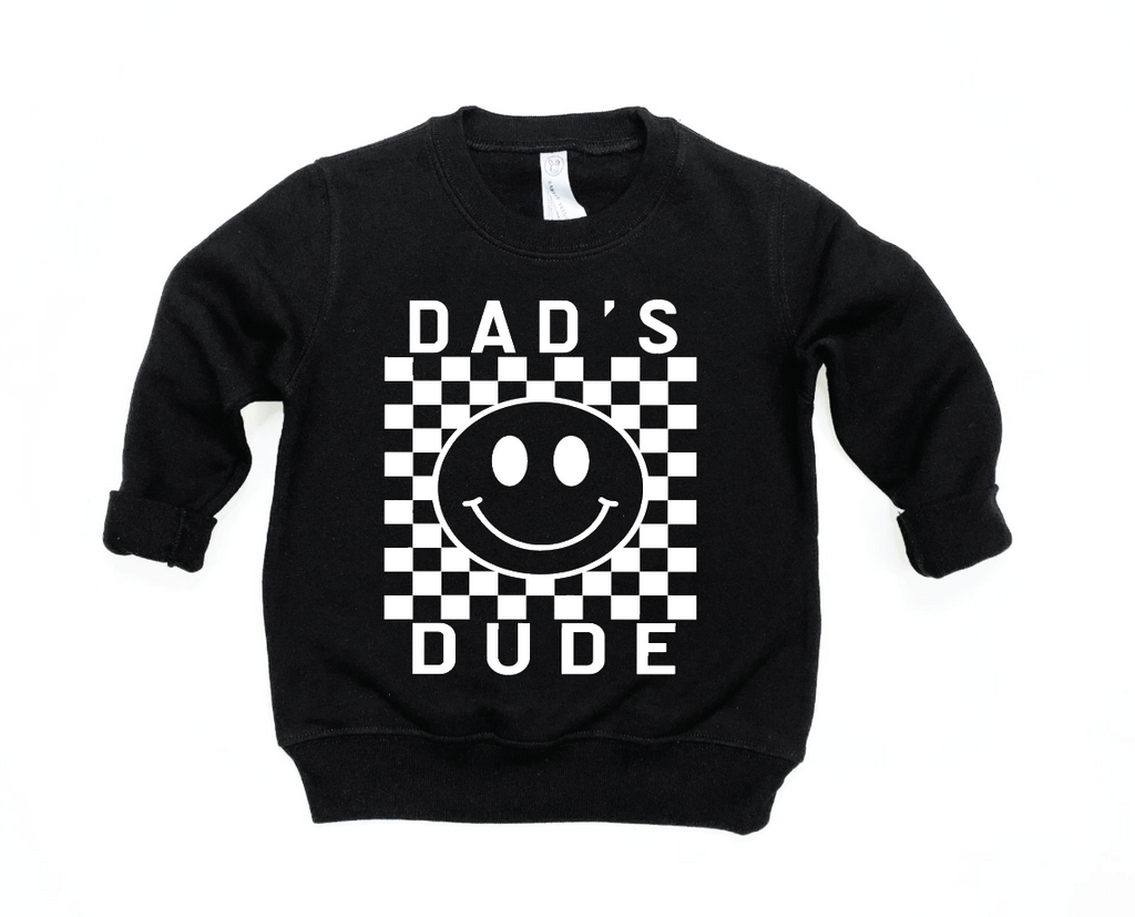 Toddler wearing a black and white checkered long sleeve pullover with Dad's Dude graphic