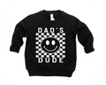 Toddler wearing a black and white checkered long sleeve pullover with Dad's Dude graphic