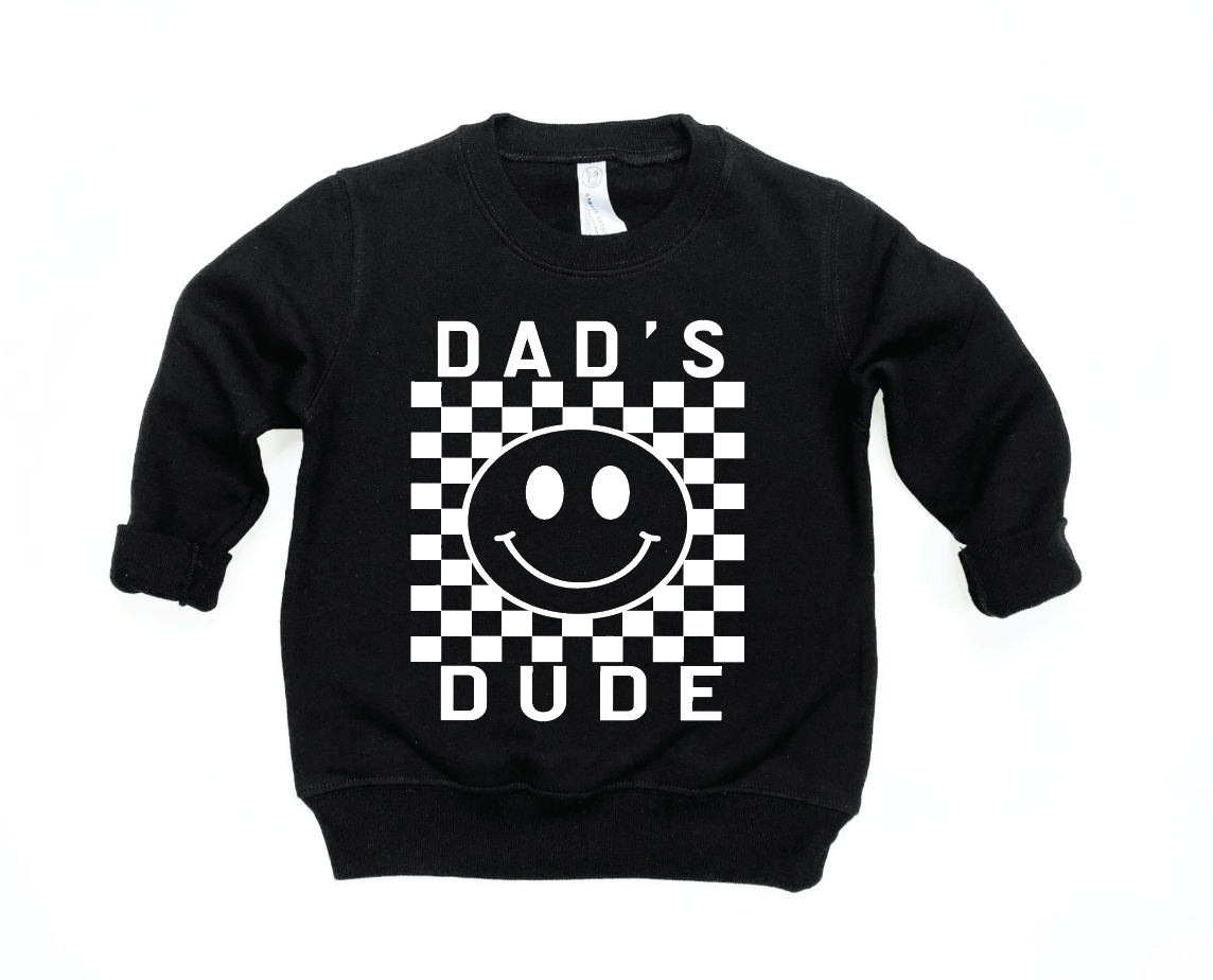 Toddler wearing a black and white checkered long sleeve pullover with Dad's Dude graphic