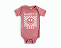 Baby wearing a Daddy's Girl geometric checkered print onesie in cotton