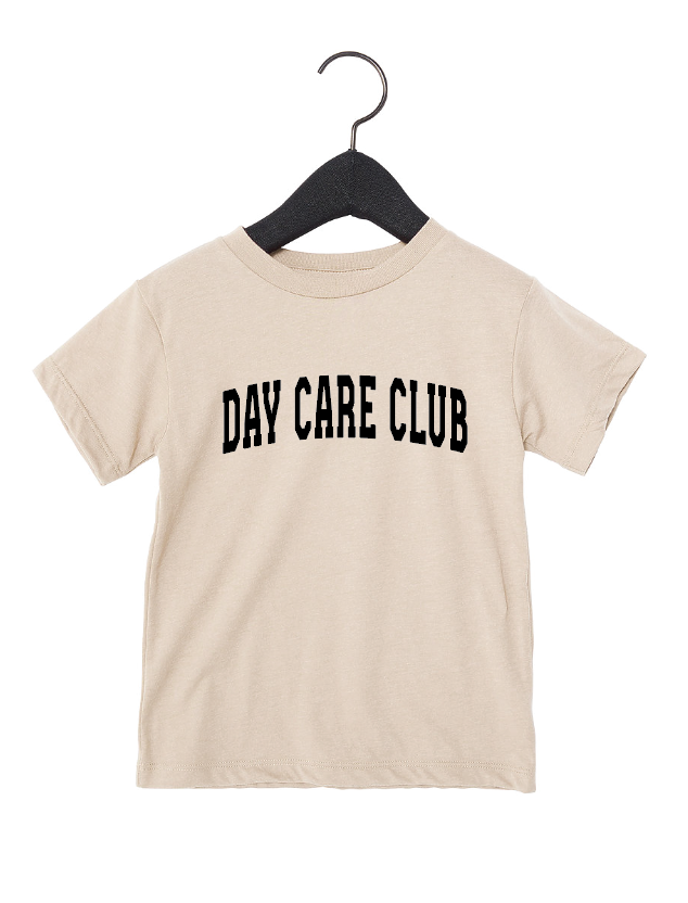 Beige and black Day Care Club varsity graphic tee.