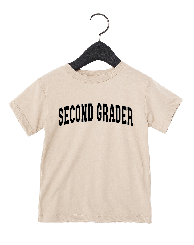 Kids wearing a Second Grader Varsity cotton tee in solid black and beige