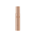 SK-II LXP Ultimate Revival Serum in a metallic rose-gold and bronze bottle.