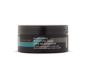 Aveda Men Pure-Formance Thickening Paste jar in black packaging with teal and orange branding accents.