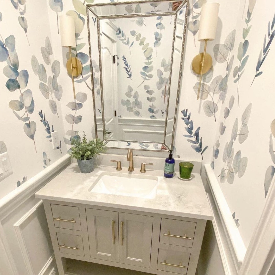 Lark floral pattern wallpaper in sage-green and blue-grey on a white background for coastal or farmhouse decor.