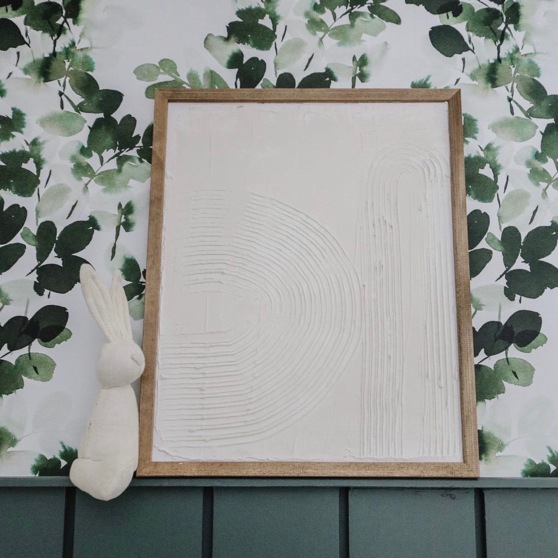Hunter botanical wallpaper in green and white applied to a modern-farmhouse styled wall.