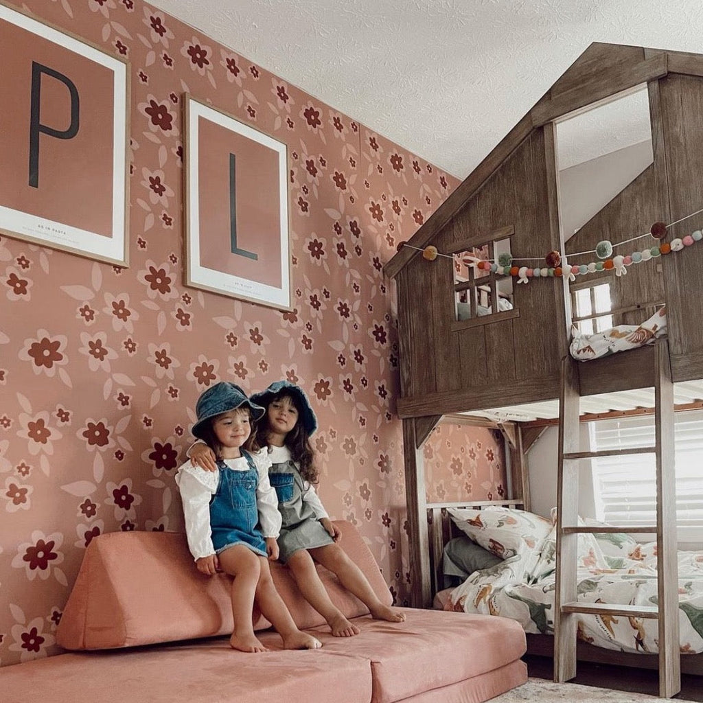 Sienna floral wallpaper in dusty-rose and terracotta on a minimalist accent wall